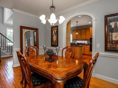 Dining room is large with sitting area and two sided fireplace. Beautiful arched doorways.