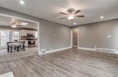 Family room opens to kitchen and hallway