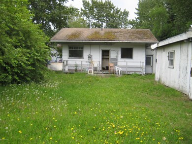 Back of house & sheds on right
