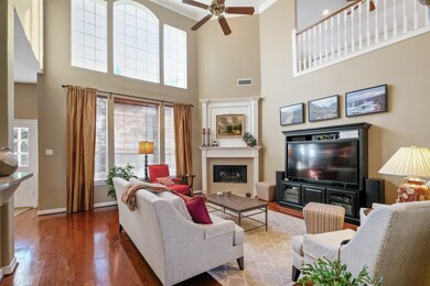 Light and bright family room is so inviting and has great views of the pool/spa and lushly landscaped back yard.