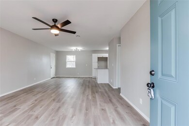 Empty room with light hardwood / wood-style floori