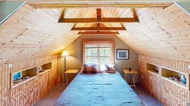 Bonus room with wood ceiling, carpet floors, and l