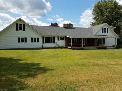 back of house with inviting covered porch