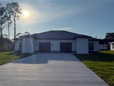 Ranch-style home featuring a garage, stucco siding