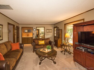View of Great Room  with dry bar, wall of windows,