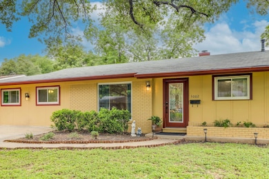 Ranch-style house with brick siding, a front yard