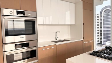 Kitchen featuring a sink, modern cabinets, light 