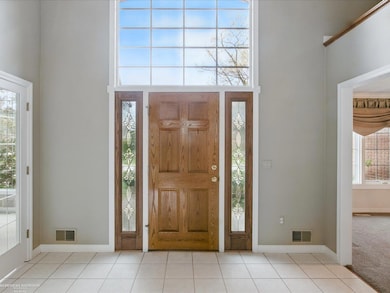 Beautiful entry hall with an abundance of natural 
