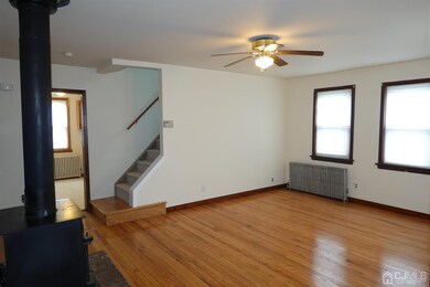 Living Room w/ newly refinished hardwood floors, f