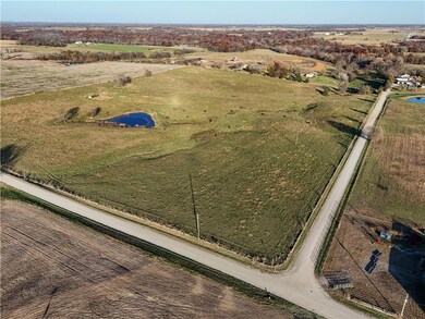 Aerial view of property and surrounding area with rural landscape and a large body of water