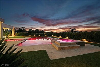Pool at dusk with a patio area and a pool with con