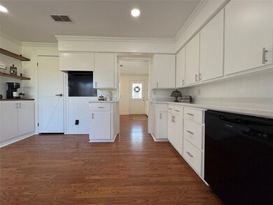 Well planned out kitchen with custom vent hood, di