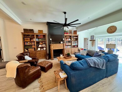Living area with light wood-style flooring, a fire