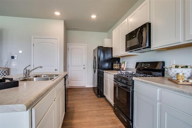 Photos of decorated model. Actual home will have stainless appliances. Refrigerator not included.