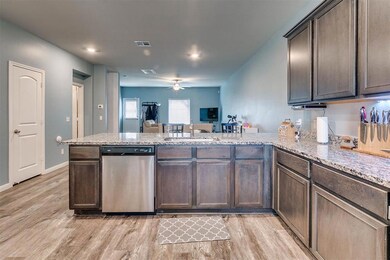 Kitchen looking into dining area and living room