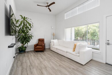 Living area with wood finished floors and ceiling