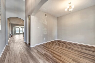 This photo showcases a bright, open hallway with e