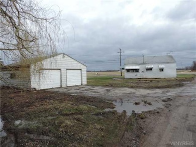 Exterior Back. Back view showing garage & residenc