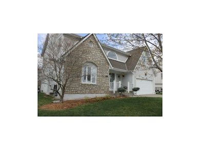 Beautiful landscaping and inviting front porch/ent