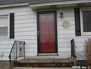Exterior Front. Entry door, beveled glass storm do