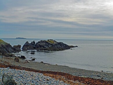Crescent sand and rock beach.