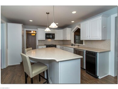 Updated Eat-in Kitchen with Corian Counters, Cente