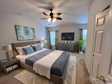 Bedroom featuring baseboards, carpet, lofted ceili