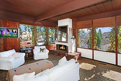 Great room with high beamed ceilings and fireplace