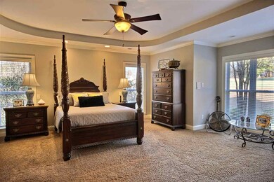 This 20x19 room has trayed ceiling, lots of window