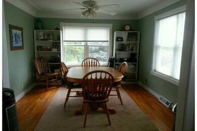 Dining Room. Cove ceiling and hardwood floors. Ple