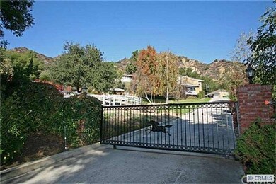 Key-Coded Private Gated Entrance with Long Drivewa