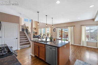 Kitchen with sink, dishwasher, a center island wit