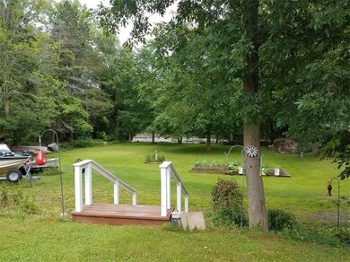 Stairs leading to side yard and the creek