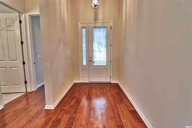 Looking back at the front door from the hallway to