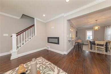 The Living Room showing the contemporary, floating, wall mounted gas fireplace