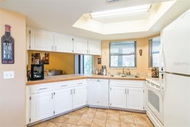 Kitchen with breakfast bar open to family room!
