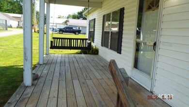 Front coved porch with swing