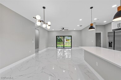 Kitchen featuring stainless steel fridge, light ma