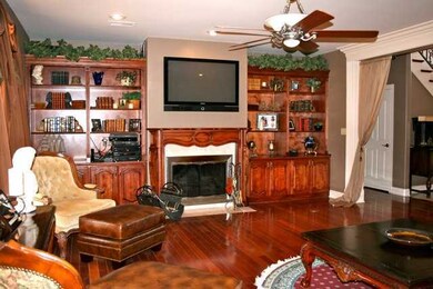 Great room with custom build ins, hardwood floorin