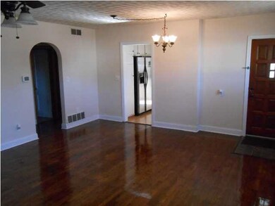 Beautiful living room with ceiling fan, refinished