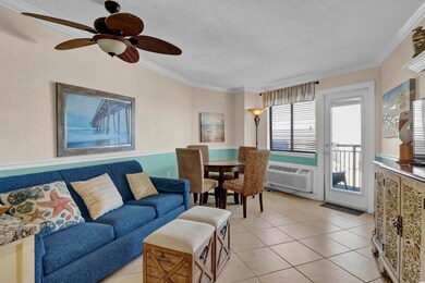 Tiled living room with ceiling fan, a wall mounted