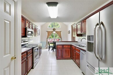 Kitchen with stainless steel appliances, pantry an