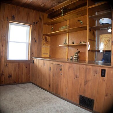Built in knotty pine hutch in the Great Room to di