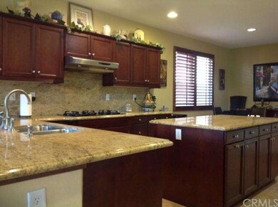 Spacious kitchen with granite counter tops and ple