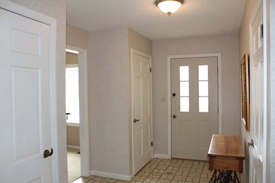 Two coat closets and Basement access
