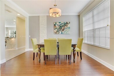 The dining area features crown molding and a uniqu