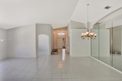 Foyer View along with Den, Living Room to the Left & Dining Room to the Right