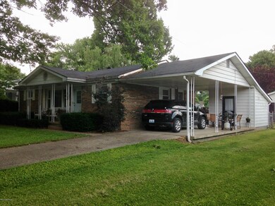 Front right view of home with carport