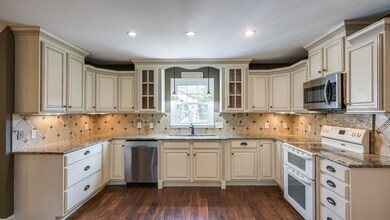 Kitchen with granite countertops.