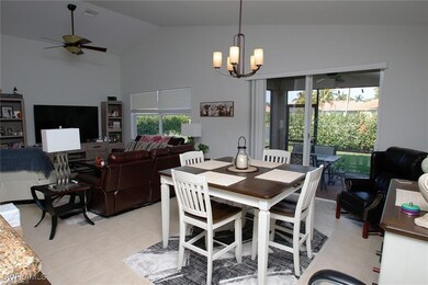 Dining room with a ceiling fan, high vaulted ceili